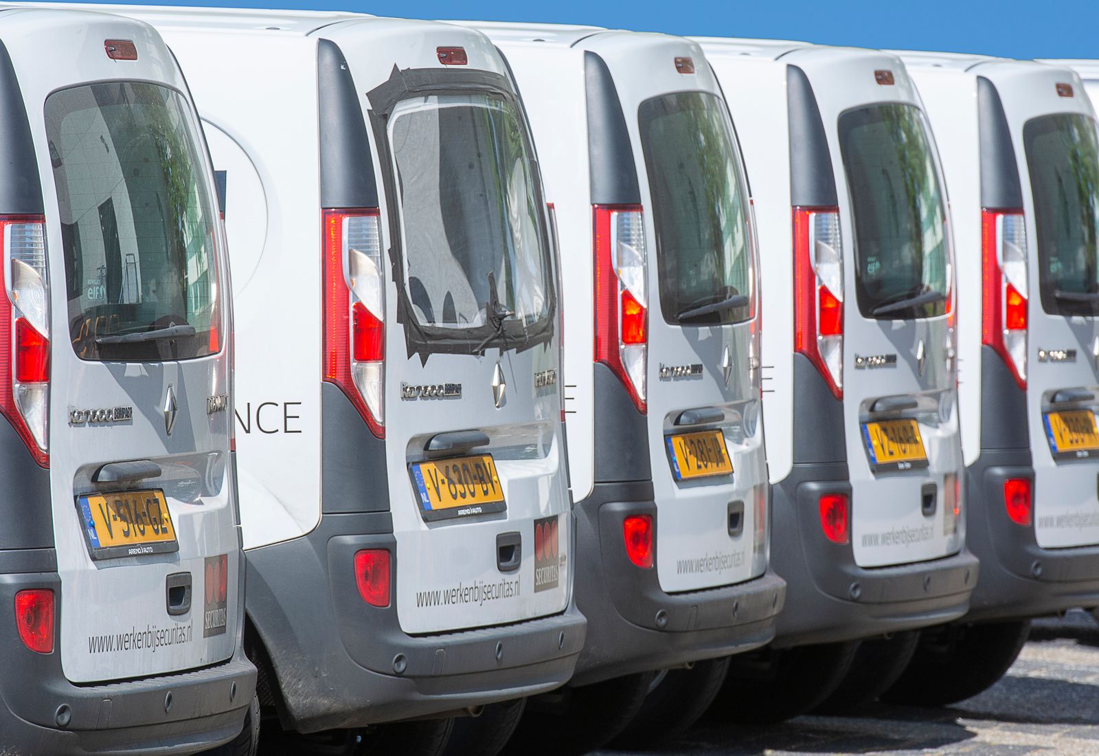 A fleet of service vans lined up and ready